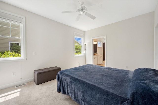394 Zephyr Rd, Williston, VT 05495 - bedroom with light colored carpet, a ceiling fan, and ensuite bath