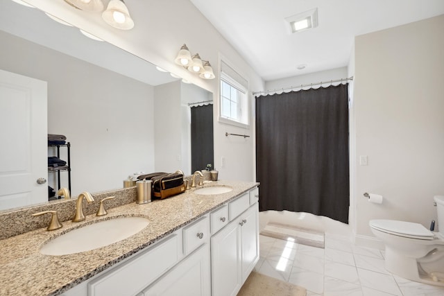 394 Zephyr Rd, Williston, VT 05495 - bathroom with double vanity and marble finish floors
