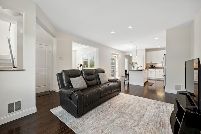 394 Zephyr Rd, Williston, VT 05495 - living room with dark wood-type flooring, recessed lighting, and stairway