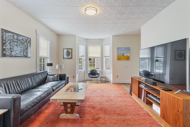 19 Baker St, Dover, NH 03820 - living area featuring wood finished floors and baseboards