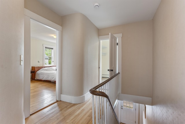 19 Baker St, Dover, NH 03820 - hallway featuring wood finished floors, an upstairs landing, and baseboard heating