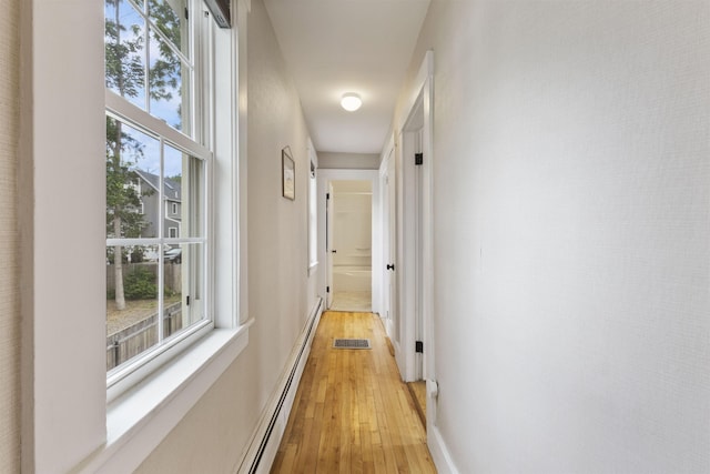 19 Baker St, Dover, NH 03820 - corridor featuring light wood-style flooring and plenty of natural light