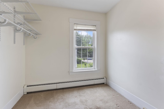 19 Baker St, Dover, NH 03820 - spacious closet with a baseboard radiator and carpet floors