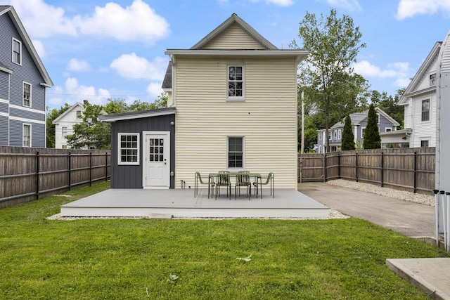 19 Baker St, Dover, NH 03820 - back of house featuring a patio, board and batten siding, and a fenced backyard