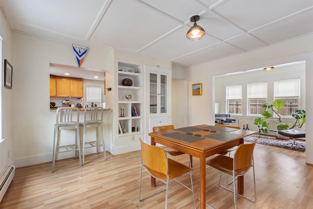 19 Baker St, Dover, NH 03820 - dining space with light wood-type flooring and a baseboard radiator