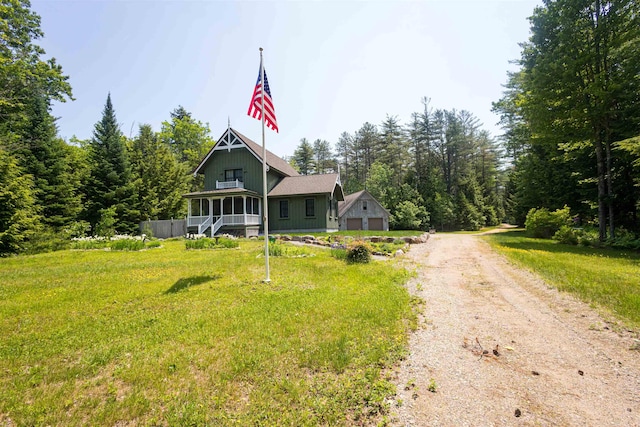 185 Huntress Bridge Rd, Effingham, NH 03882 - view of front facade with dirt driveway, a porch, and a garage