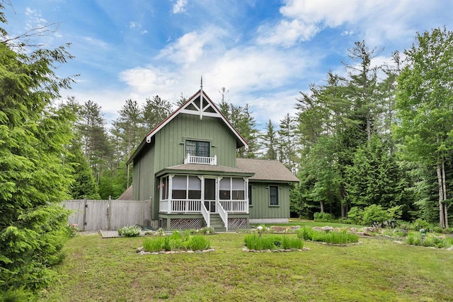 185 Huntress Bridge Rd, Effingham, NH 03882 - rear view of house featuring a gate, a sunroom, and roof with shingles