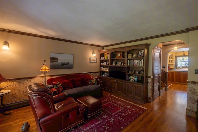 185 Huntress Bridge Rd, Effingham, NH 03882 - living room featuring wood finished floors, arched walkways, crown molding, and a wainscoted wall