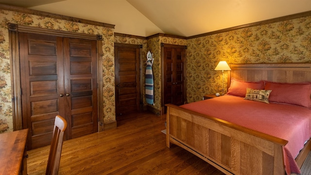 185 Huntress Bridge Rd, Effingham, NH 03882 - bedroom featuring wood finished floors, vaulted ceiling, and wallpapered walls