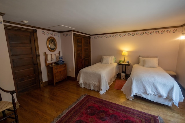 185 Huntress Bridge Rd, Effingham, NH 03882 - bedroom featuring wood finished floors, crown molding, and a closet