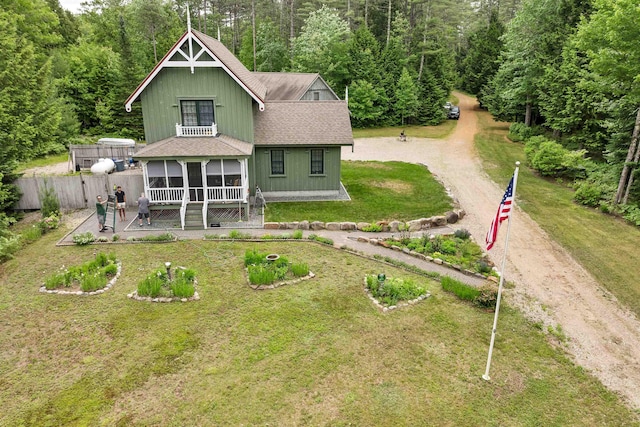 185 Huntress Bridge Rd, Effingham, NH 03882 - rear view of property with roof with shingles, dirt driveway, a sunroom, and a view of trees