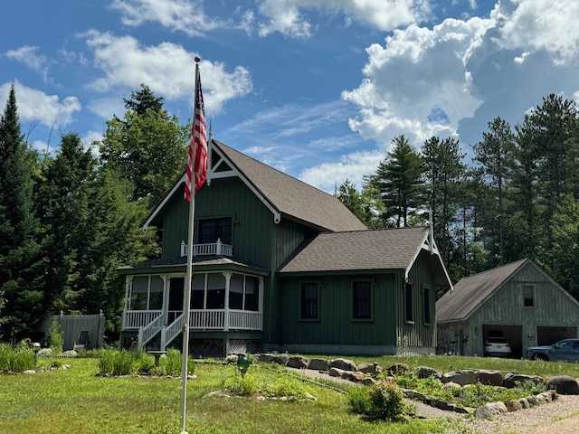 185 Huntress Bridge Rd, Effingham, NH 03882 - back of house with a balcony, a shingled roof, a garage, and a yard