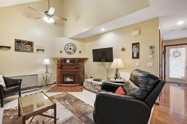 6 Cumberland Rd Unit 12, Gilford, NH 03249 - living room featuring a glass covered fireplace, ceiling fan, recessed lighting, and wood finished floors