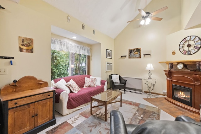 6 Cumberland Rd Unit 12, Gilford, NH 03249 - living room with a glass covered fireplace, ceiling fan, high vaulted ceiling, and a wall mounted AC