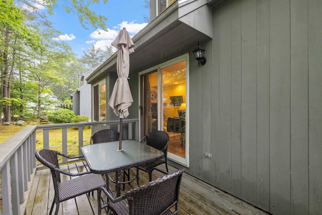 6 Cumberland Rd Unit 12, Gilford, NH 03249 - wooden terrace with outdoor dining area