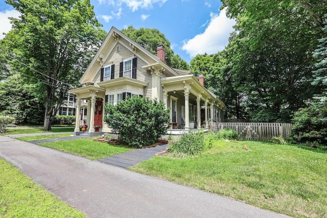 42 Lyndon St, Concord, NH 03301 - view of front of home featuring a chimney and a porch