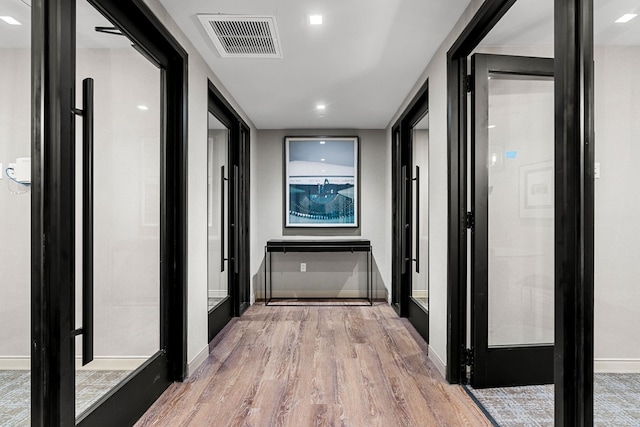 18 Artisan Dr Unit 416, Salem, NH 03079 - corridor with light wood finished floors and baseboards