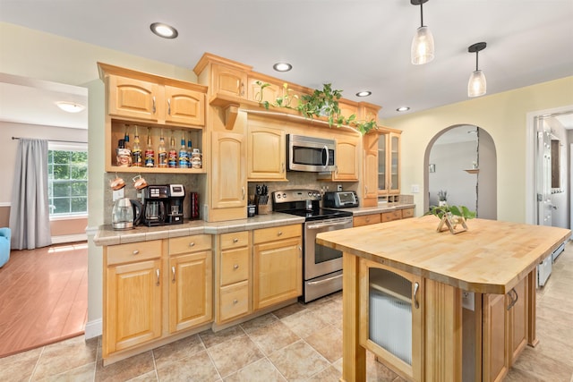 70 Riverside Dr, Allenstown, NH 03275 - kitchen featuring appliances with stainless steel finishes, light brown cabinets, a kitchen island, and recessed lighting