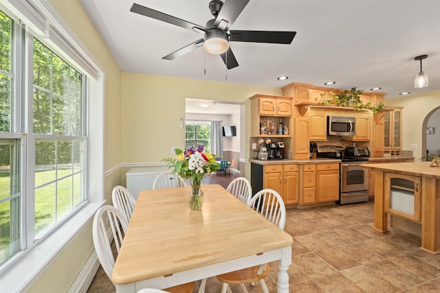 70 Riverside Dr, Allenstown, NH 03275 - dining space with ceiling fan, recessed lighting, arched walkways, and light tile patterned floors