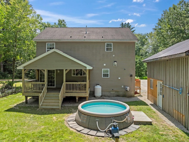 70 Riverside Dr, Allenstown, NH 03275 - back of property featuring a wooden deck and a lawn