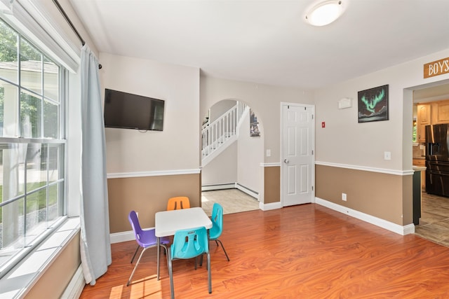 70 Riverside Dr, Allenstown, NH 03275 - dining room with arched walkways, light wood finished floors, and baseboard heating
