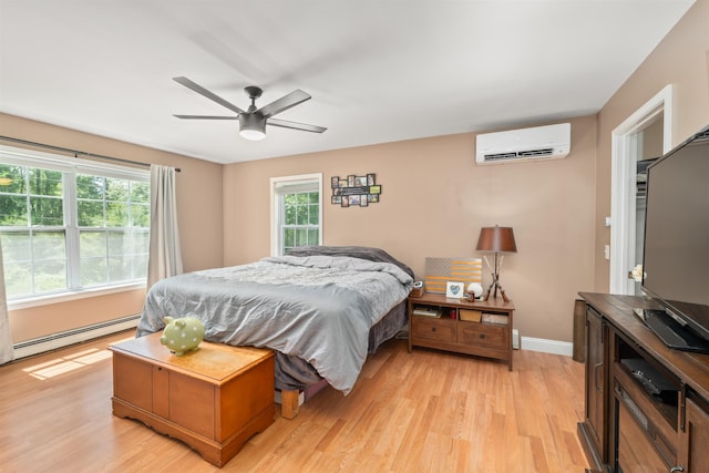 70 Riverside Dr, Allenstown, NH 03275 - bedroom featuring a wall mounted air conditioner, light wood-style flooring, a baseboard radiator, and ceiling fan