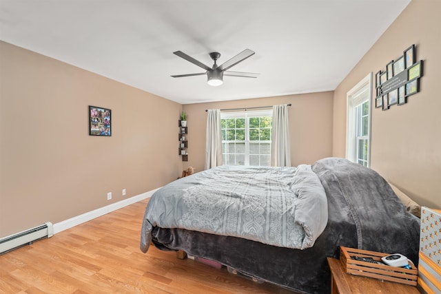 70 Riverside Dr, Allenstown, NH 03275 - bedroom with wood finished floors, a baseboard radiator, and ceiling fan