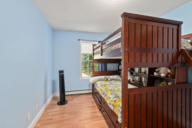 70 Riverside Dr, Allenstown, NH 03275 - bedroom with a baseboard radiator and wood finished floors