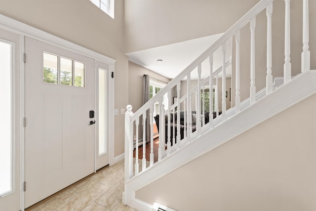70 Riverside Dr, Allenstown, NH 03275 - entrance foyer featuring plenty of natural light, a towering ceiling, stairway, and light tile patterned flooring