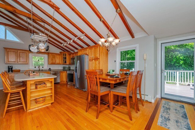 15B Vine St, South Berwick, ME 03908 - dining space featuring a chandelier, beamed ceiling, light wood-type flooring, healthy amount of natural light, and high vaulted ceiling