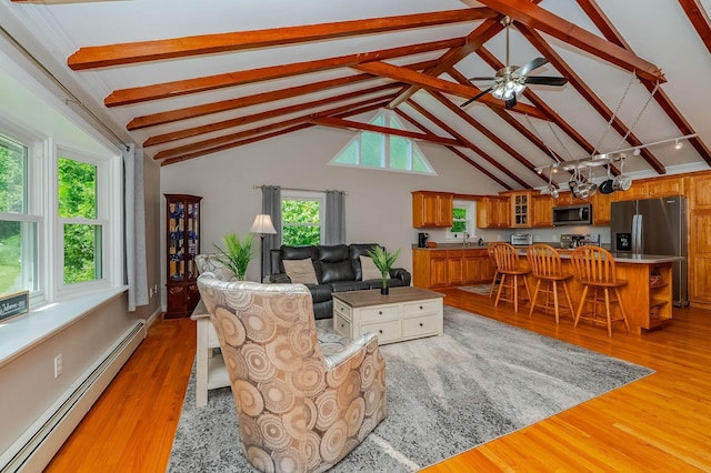 15B Vine St, South Berwick, ME 03908 - living room featuring baseboard heating, light wood-style floors, and a chandelier