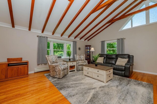 15B Vine St, South Berwick, ME 03908 - living area with high vaulted ceiling, beam ceiling, a baseboard heating unit, and light wood-style flooring