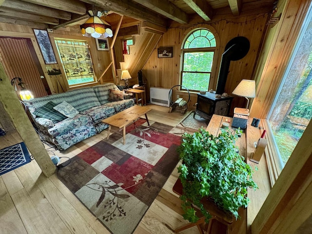 14 Threshold Way, Corinth, VT 05040 - living room featuring wooden walls, a wood stove, beam ceiling, and wood finished floors