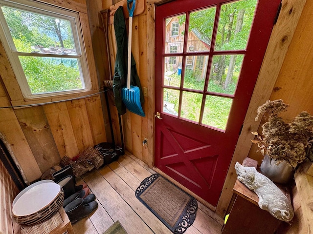 14 Threshold Way, Corinth, VT 05040 - doorway to outside with wooden walls, plenty of natural light, and hardwood / wood-style floors