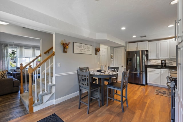 13 Rangers Dr Unit B, Hudson, NH 03051 - dining area featuring wood finished floors, recessed lighting, and stairs