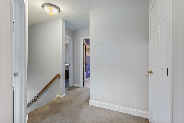 13 Rangers Dr Unit B, Hudson, NH 03051 - corridor with an upstairs landing, carpet floors, and a textured ceiling