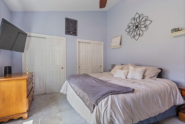 13 Rangers Dr Unit B, Hudson, NH 03051 - bedroom with multiple closets, light carpet, lofted ceiling, and ceiling fan