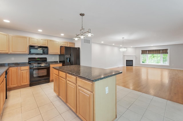 70B Shadowbrook Dr Unit 70B, Hudson, NH 03051 - kitchen with black appliances, light brown cabinets, light tile patterned flooring, recessed lighting, and a center island