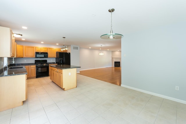 70B Shadowbrook Dr Unit 70B, Hudson, NH 03051 - kitchen with black appliances, recessed lighting, a kitchen island, dark stone counters, and pendant lighting