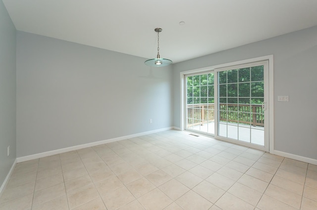 70B Shadowbrook Dr Unit 70B, Hudson, NH 03051 - spare room with light tile patterned floors and baseboards