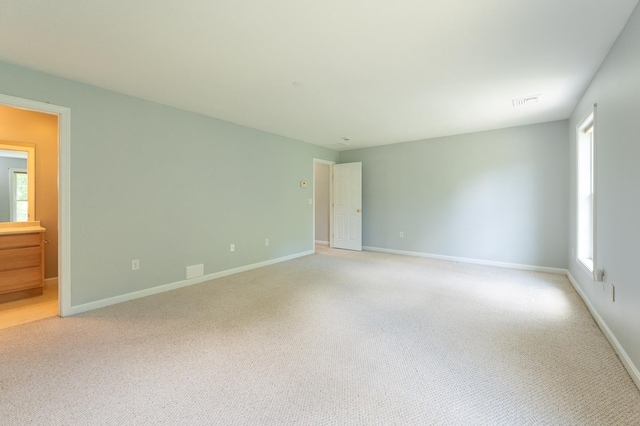 70B Shadowbrook Dr Unit 70B, Hudson, NH 03051 - spare room with baseboards and light carpet