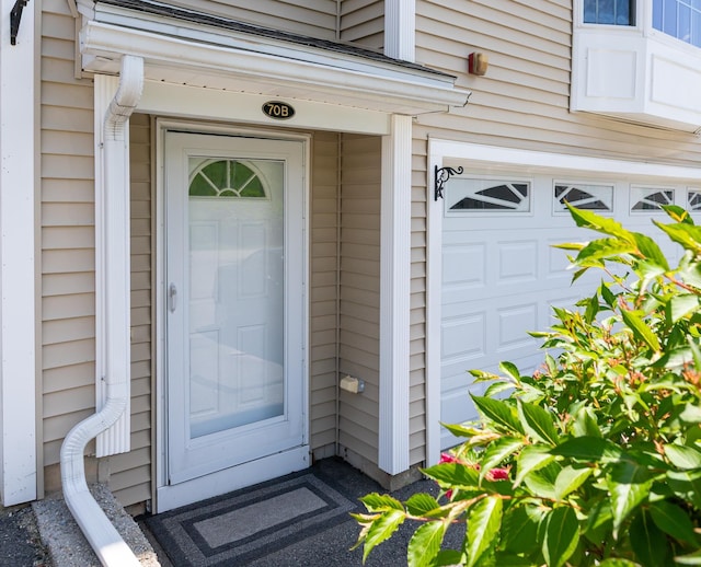 70B Shadowbrook Dr Unit 70B, Hudson, NH 03051 - view of exterior entry with a garage