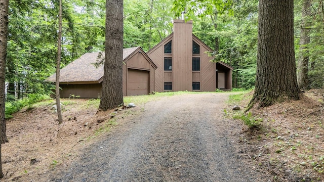 49 Longwood Dr, Grantham, NH 03753 - view of front of home featuring a chimney and gravel driveway
