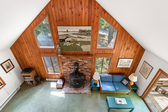 49 Longwood Dr, Grantham, NH 03753 - living area featuring a baseboard radiator, wood walls, carpet flooring, lofted ceiling, and plenty of natural light