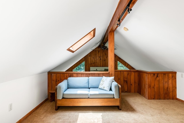 49 Longwood Dr, Grantham, NH 03753 - living area featuring a skylight, wooden walls, carpet, and track lighting