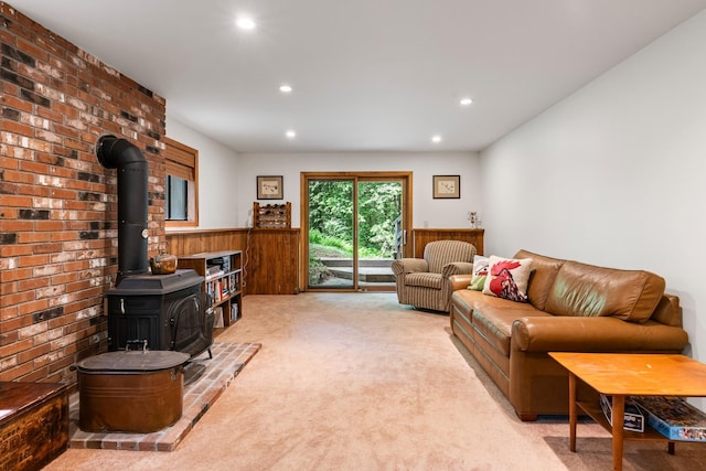 49 Longwood Dr, Grantham, NH 03753 - living room featuring light carpet, a wood stove, a wainscoted wall, recessed lighting, and wooden walls