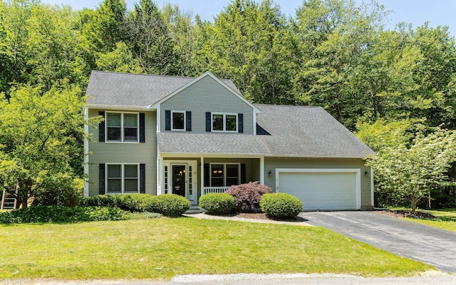 81 Summit Ridge Dr, Keene, NH 03431 - view of front facade featuring a garage, driveway, a front yard, a porch, and a shingled roof