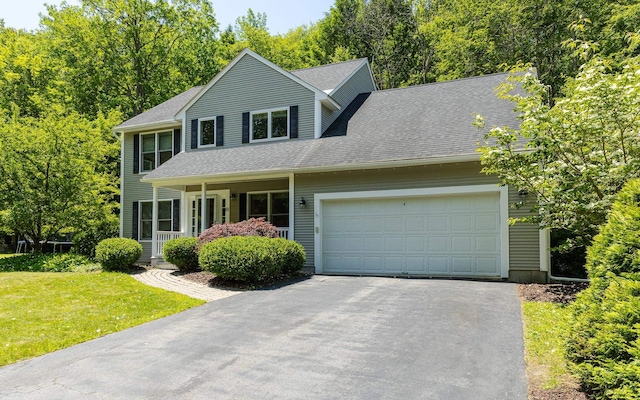 81 Summit Ridge Dr, Keene, NH 03431 - view of front of home with driveway, a garage, a front lawn, covered porch, and a shingled roof