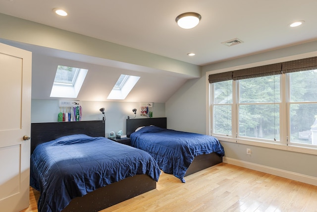81 Summit Ridge Dr, Keene, NH 03431 - bedroom with a skylight, multiple windows, vaulted ceiling, wood finished floors, and recessed lighting