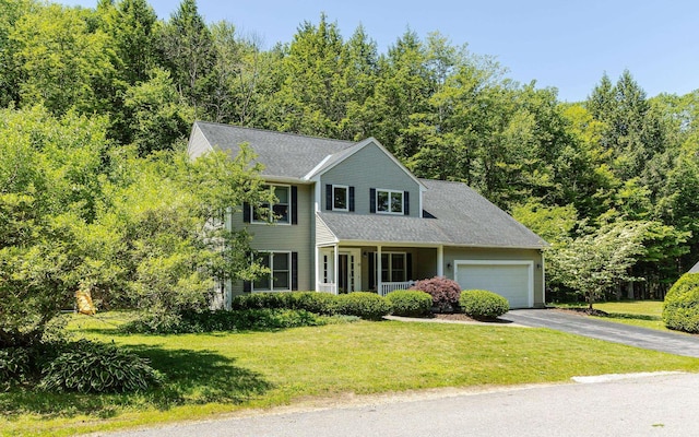 81 Summit Ridge Dr, Keene, NH 03431 - colonial house with a front lawn, driveway, a garage, and covered porch
